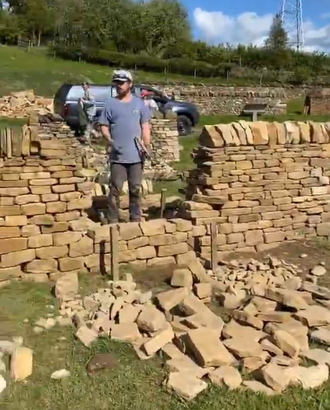 man building dry stone wall